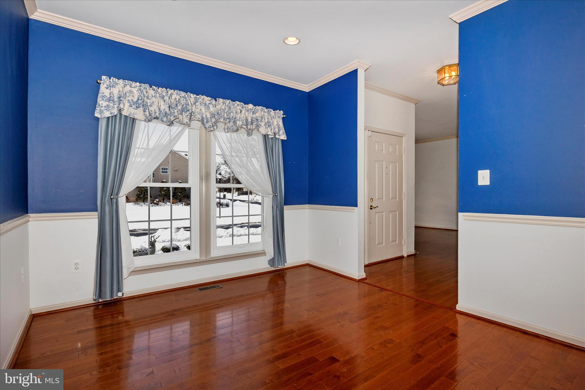 828 Geronimo Drive Frederick, MD 21701 - Photo 20 of 64 a view of an empty room with window and wooden floor