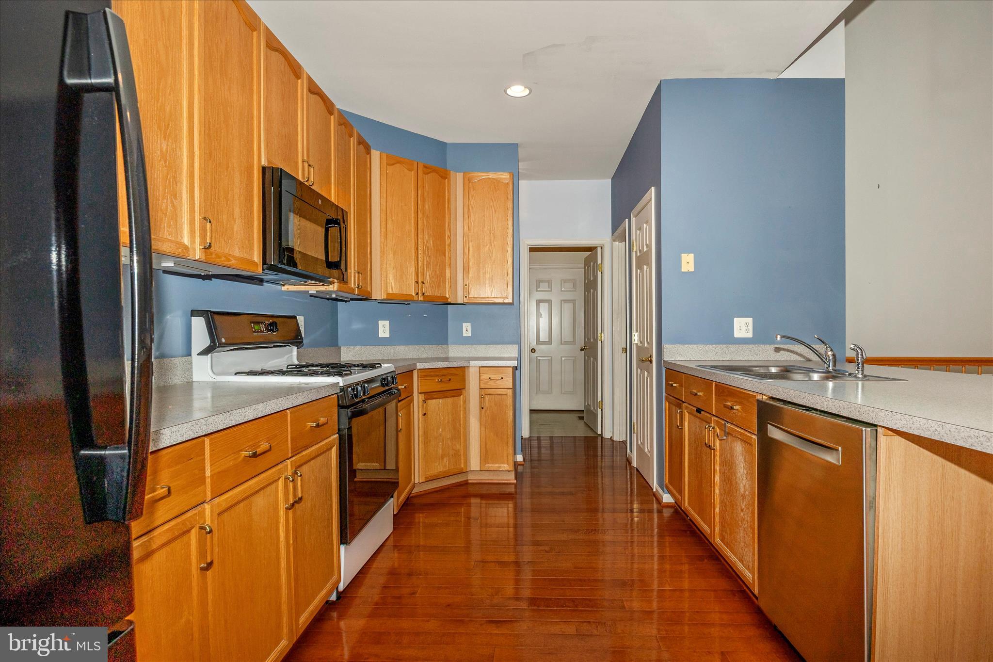 828 Geronimo Drive Frederick, MD 21701 - Photo 24 of 64 a kitchen with stainless steel appliances granite countertop a stove a sink and a refrigerator