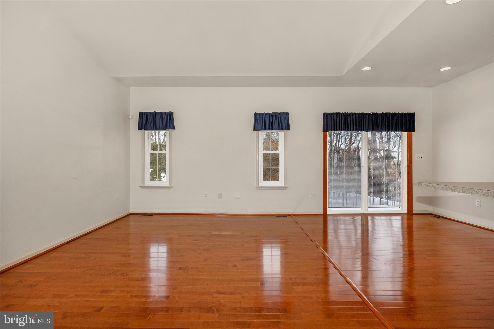 828 Geronimo Drive Frederick, MD 21701 - Photo 29 of 64 a view of an empty room with wooden floor and a window