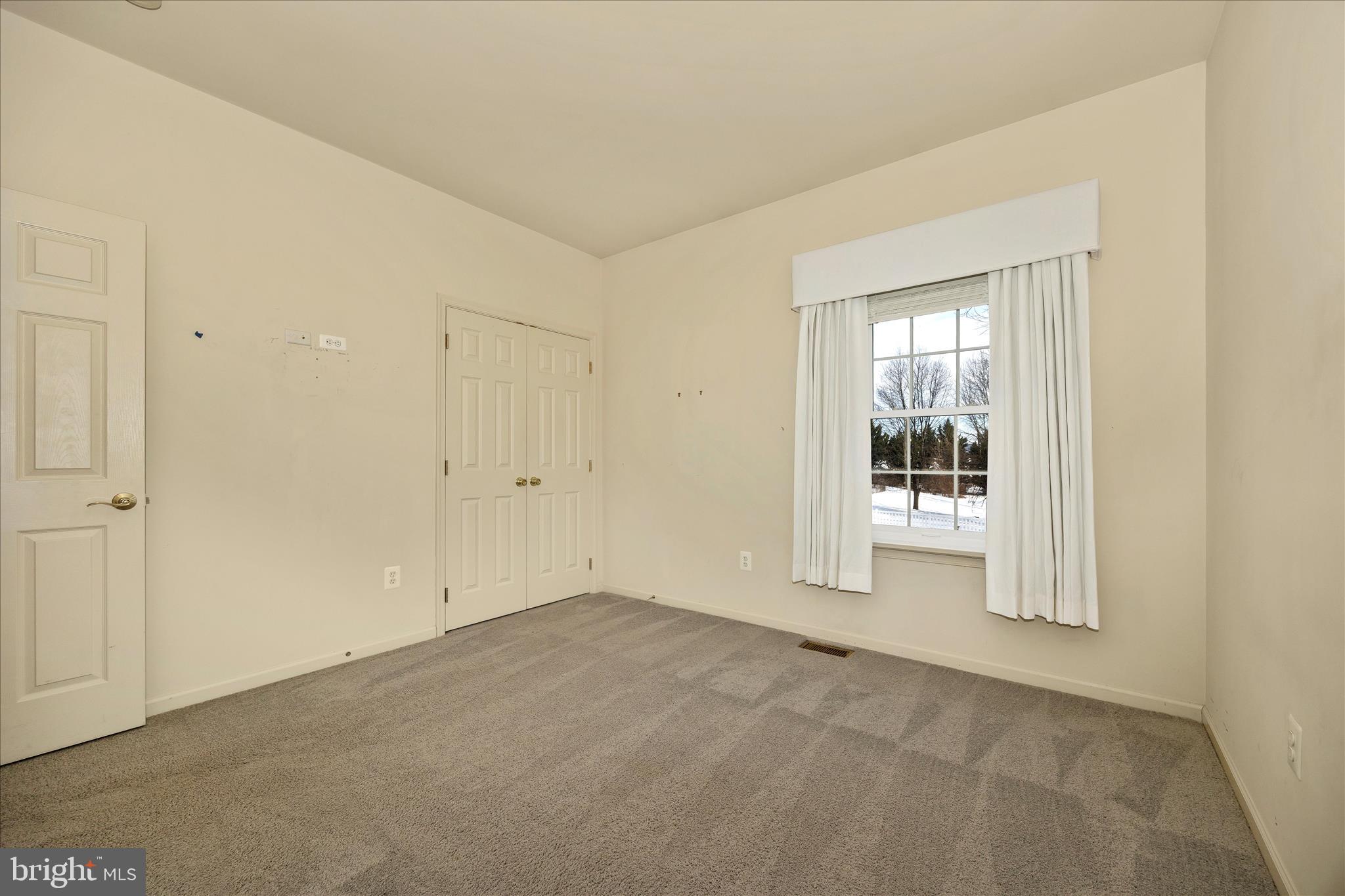 828 Geronimo Drive Frederick, MD 21701 - Photo 37 of 64 a view of an empty room with a window