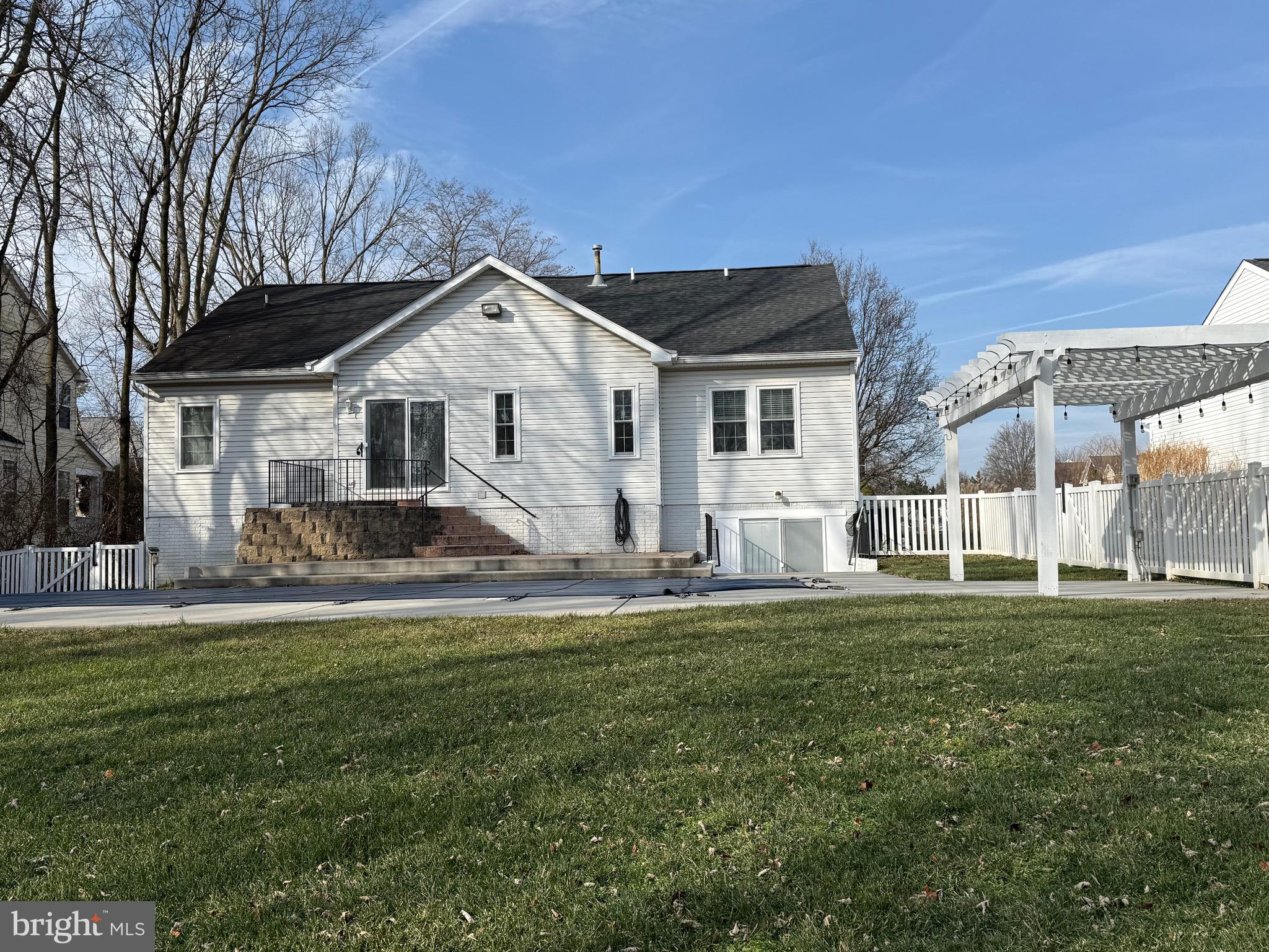 828 Geronimo Drive Frederick, MD 21701 - Photo 4 of 64 a front view of a house with a garden and trees