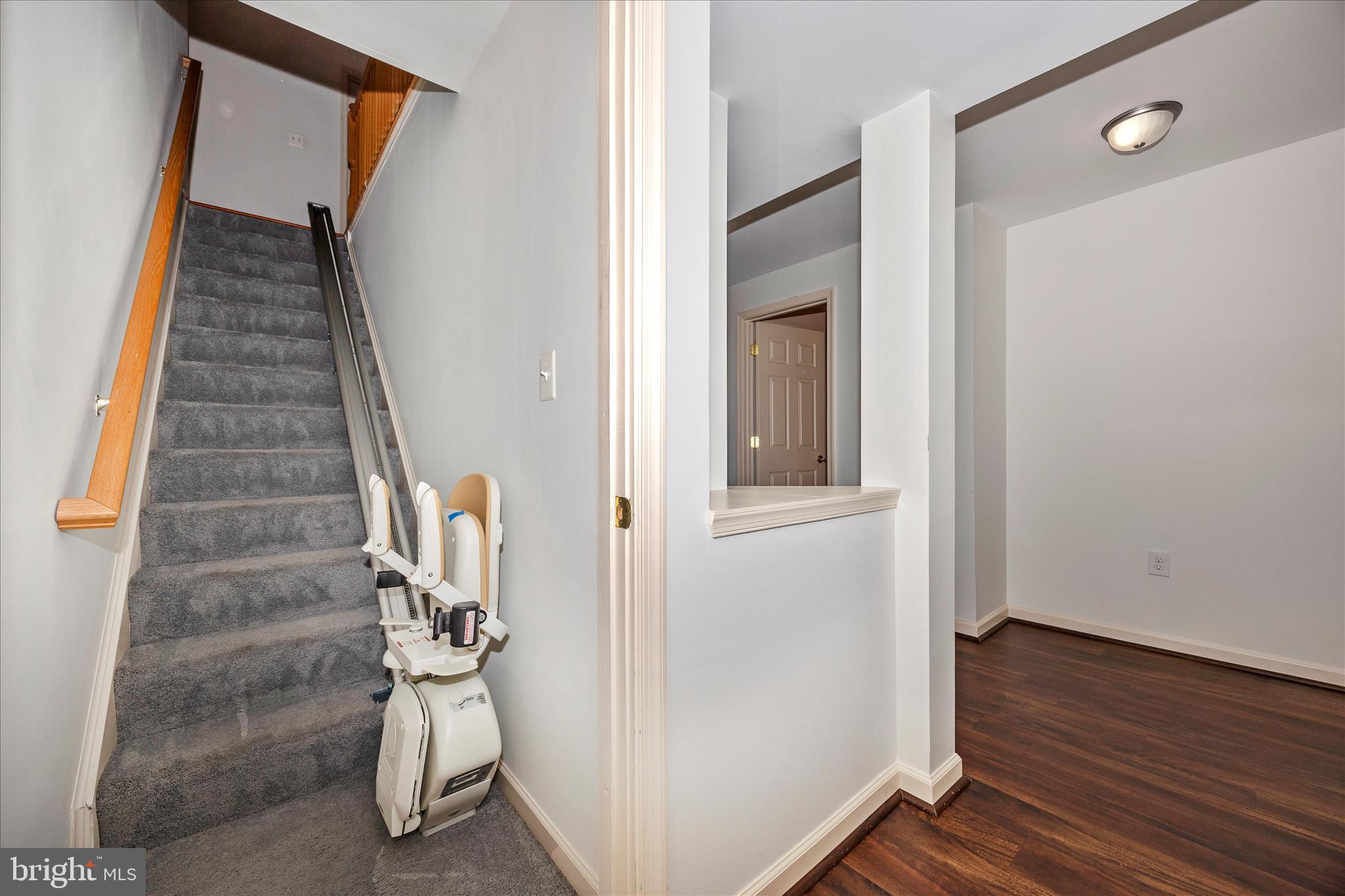 828 Geronimo Drive Frederick, MD 21701 - Photo 42 of 64 a view of front door with wooden floor and stairs