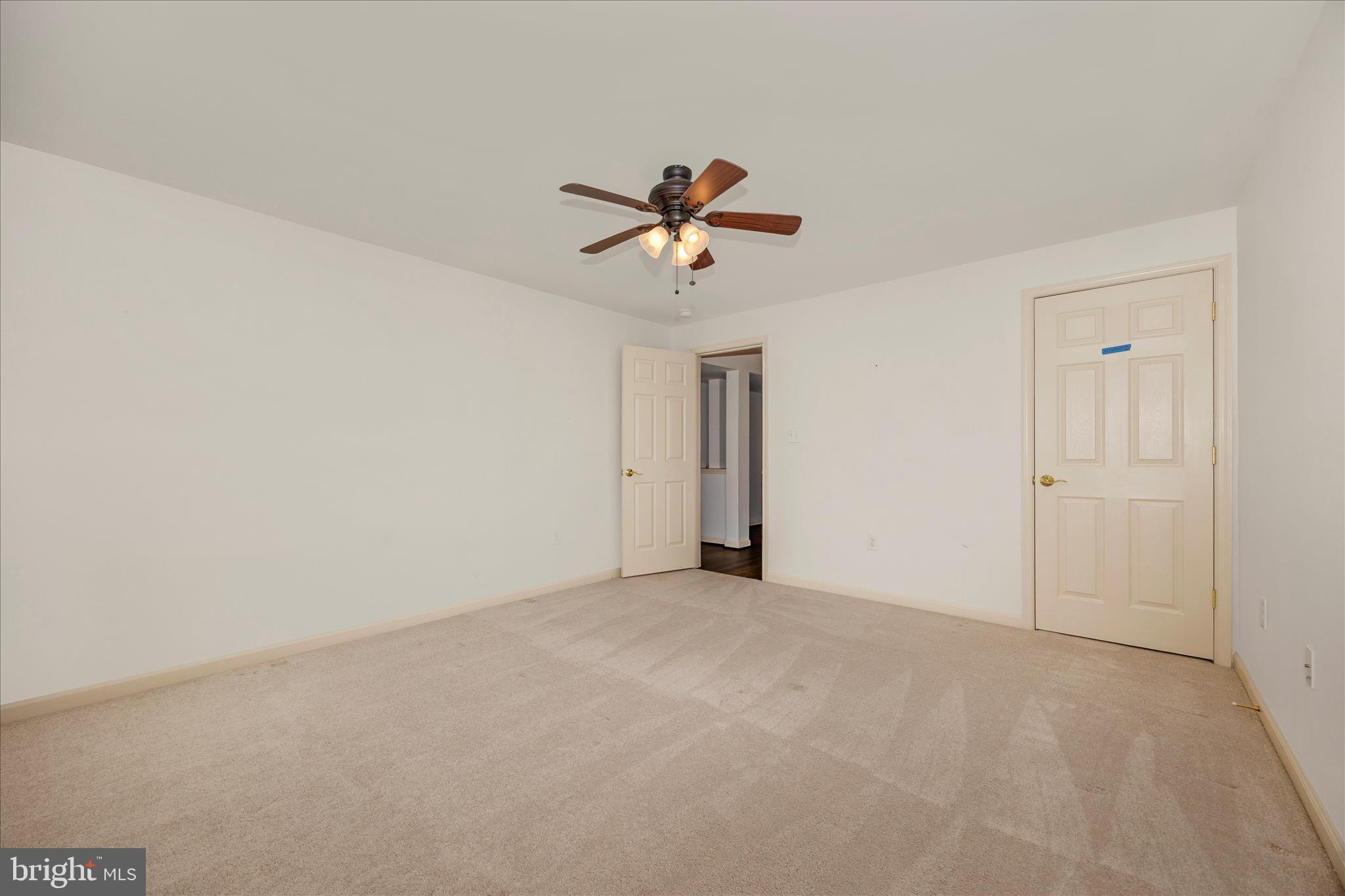 828 Geronimo Drive Frederick, MD 21701 - Photo 48 of 64 a view of a room with a ceiling fan and a window