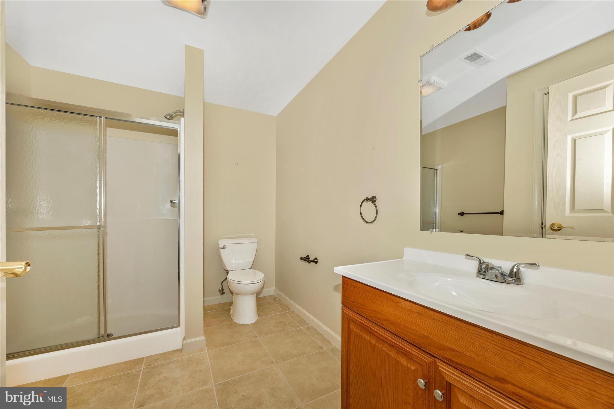 828 Geronimo Drive Frederick, MD 21701 - Photo 49 of 64 a bathroom with a sink a toilet and shower