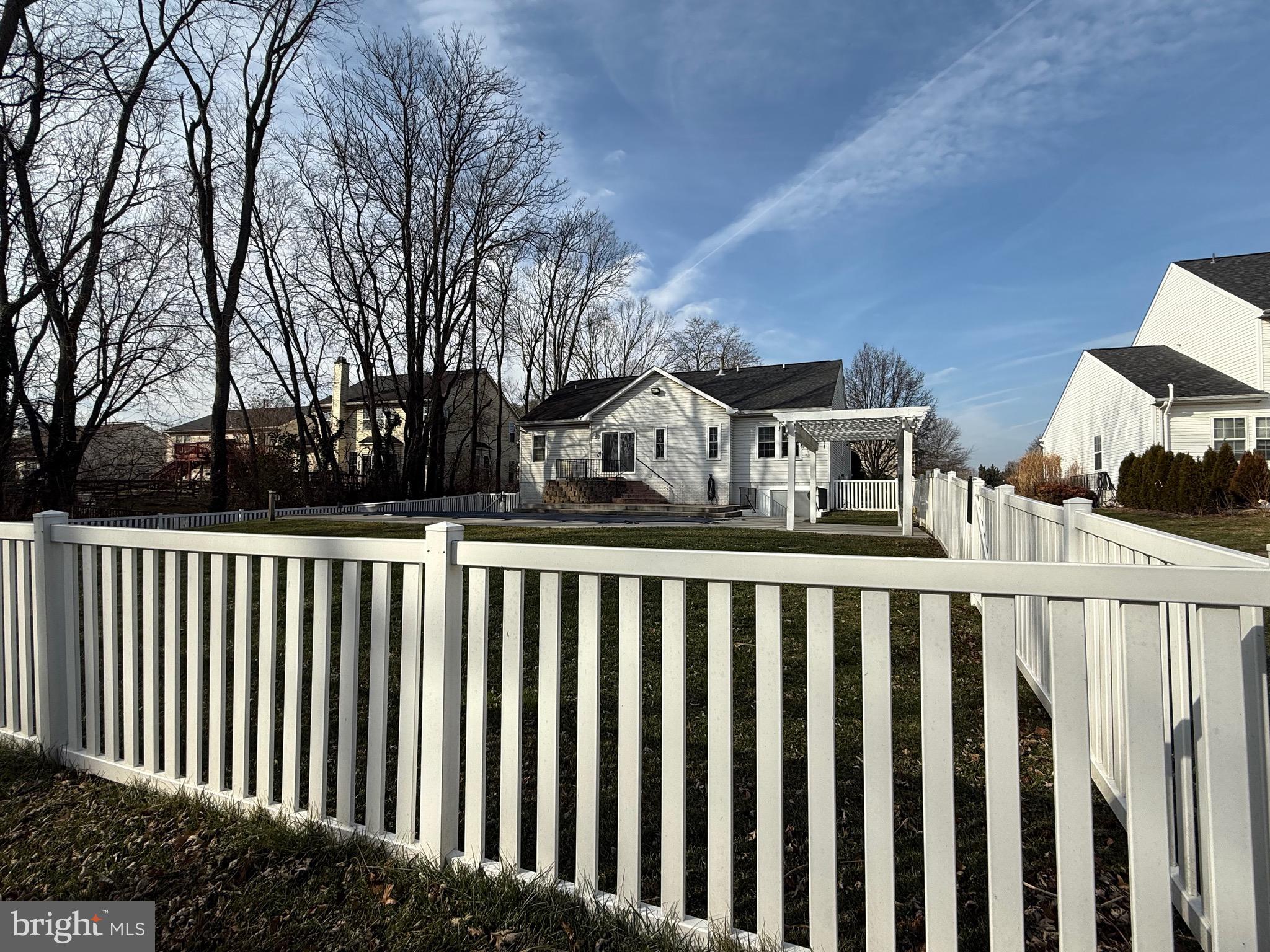 828 Geronimo Drive Frederick, MD 21701 - Photo 5 of 64 a view of wooden fence and a trees