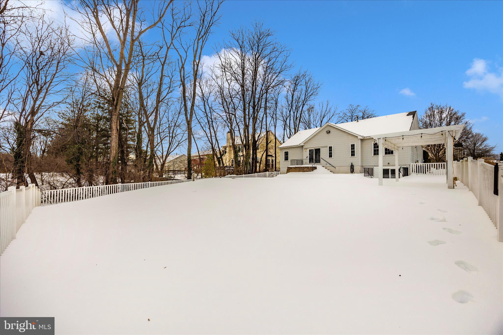 828 Geronimo Drive Frederick, MD 21701 - Photo 60 of 64 a view of a white house with a snow in yard