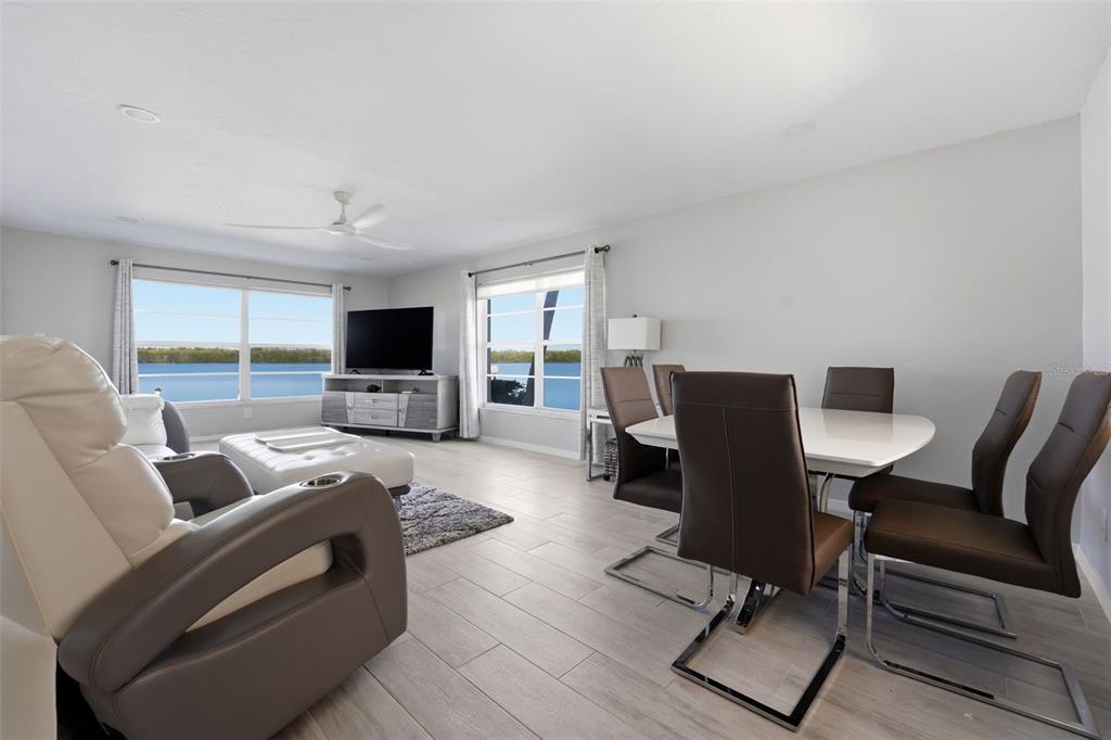 4440 Exeter Drive, Unit 106 Longboat Key, FL 34228 - Photo 6 of 26 a living room with furniture and a flat screen tv