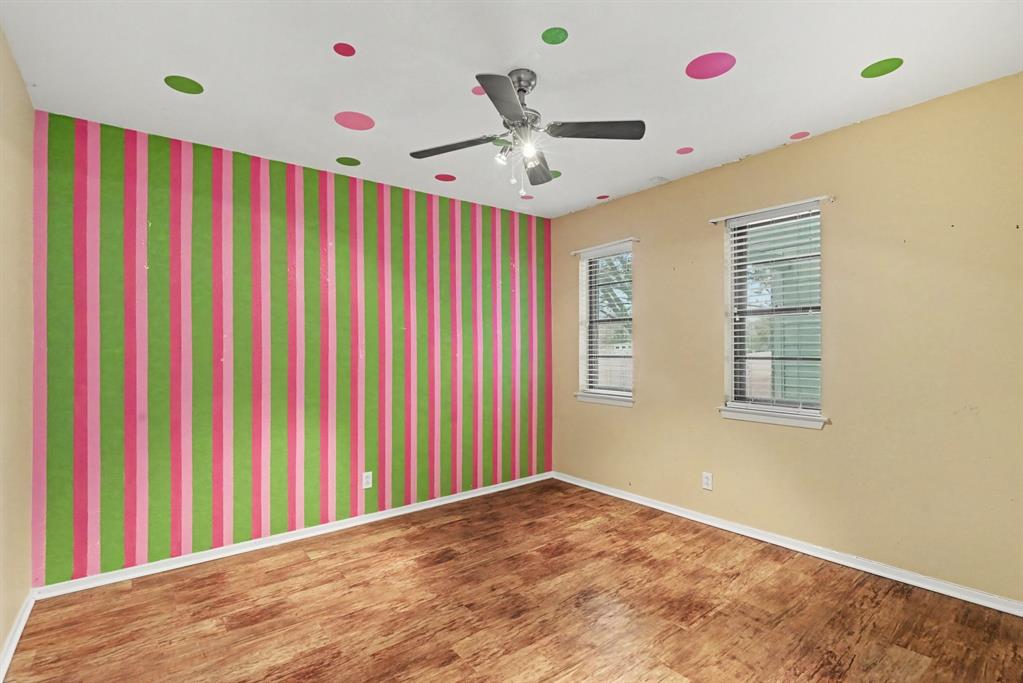 332 Cook Road Willow Park, TX 76087 - Photo 22 of 26 Wood-finish flooring, ceiling fan, and two windows with blinds