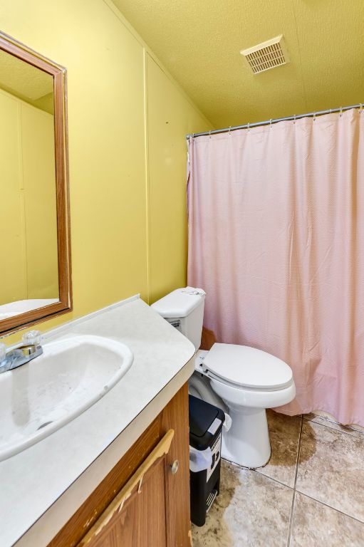 214 The Ranch Road Del Valle, TX 78617 - Photo 20 of 40 a bathroom with a sink and a toilet