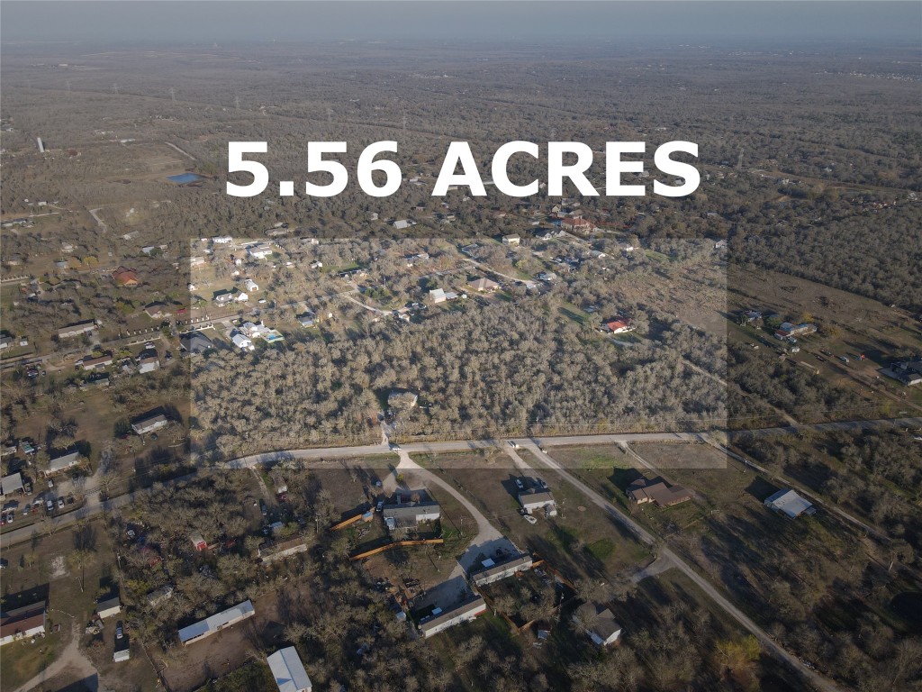 214 The Ranch Road Del Valle, TX 78617 - Photo 2 of 40 a sign that is sitting on a rock
