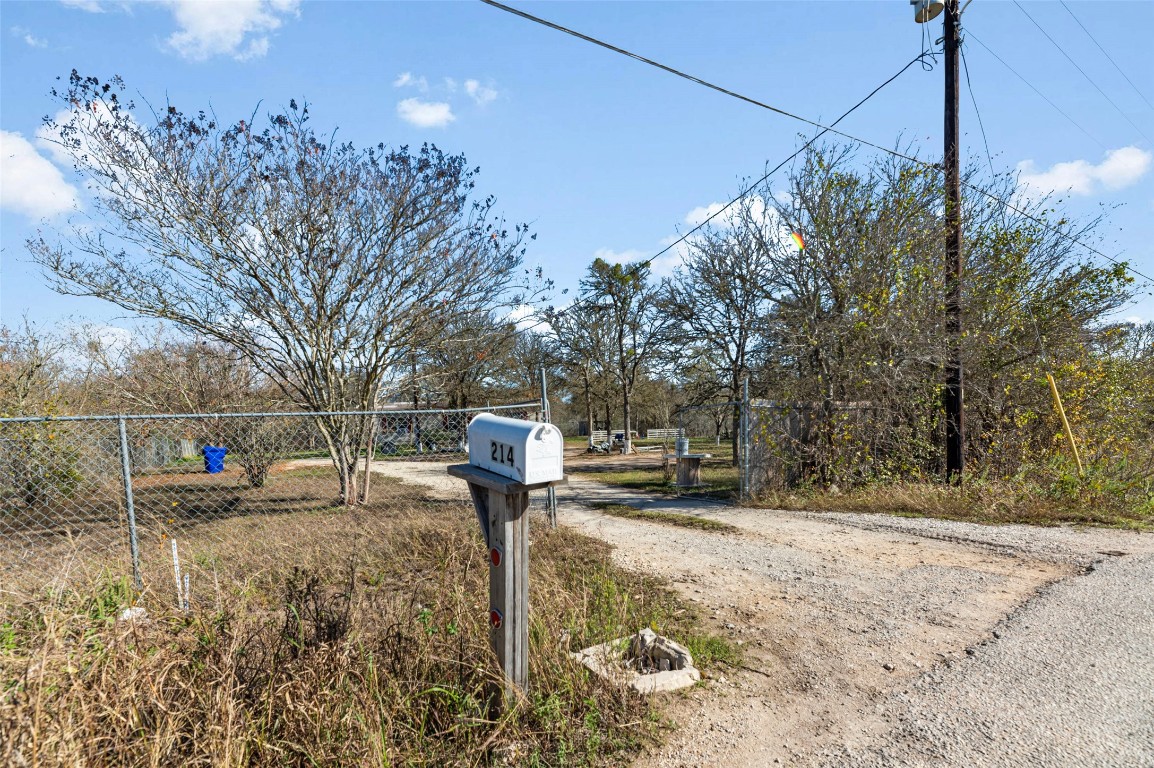214 The Ranch Road Del Valle, TX 78617 - Photo 21 of 40 a fire hydrant in the middle of a field