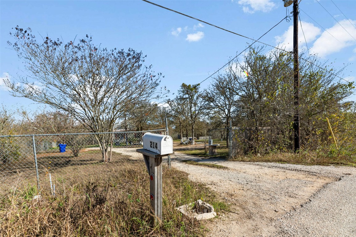 214 The Ranch Road Del Valle, TX 78617 - Photo 22 of 40 a front view of a house with a yard