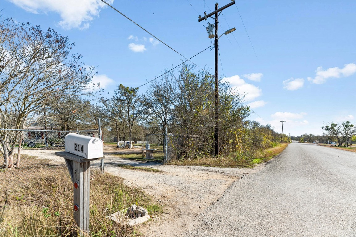 214 The Ranch Road Del Valle, TX 78617 - Photo 23 of 40 a street sign on the side of the road
