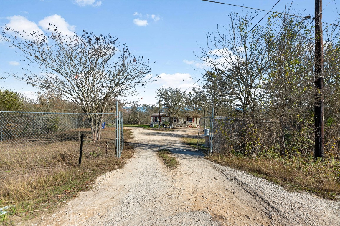 214 The Ranch Road Del Valle, TX 78617 - Photo 24 of 40 a view of a yard with a tree