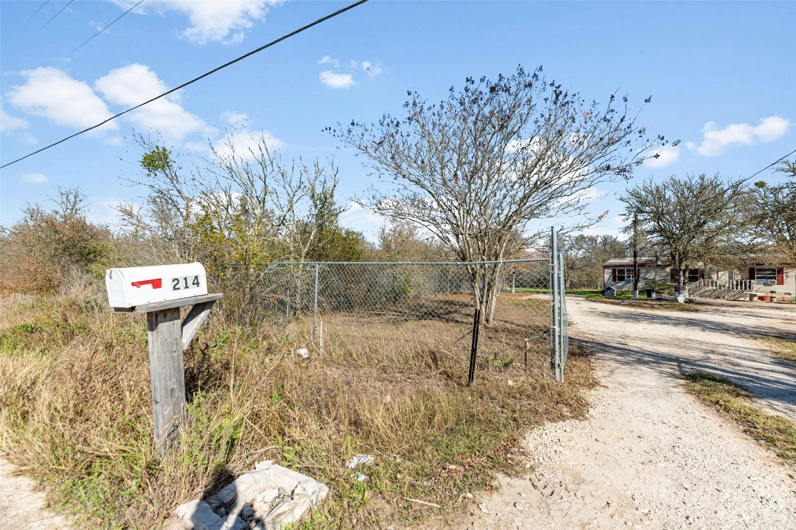 214 The Ranch Road Del Valle, TX 78617 - Photo 25 of 40 a view of backyard of a house