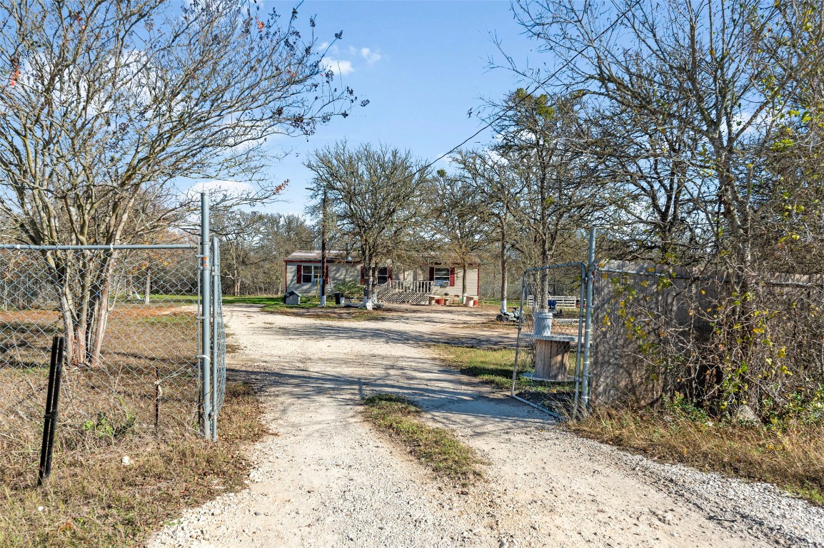 214 The Ranch Road Del Valle, TX 78617 - Photo 26 of 40 a view of street with large trees