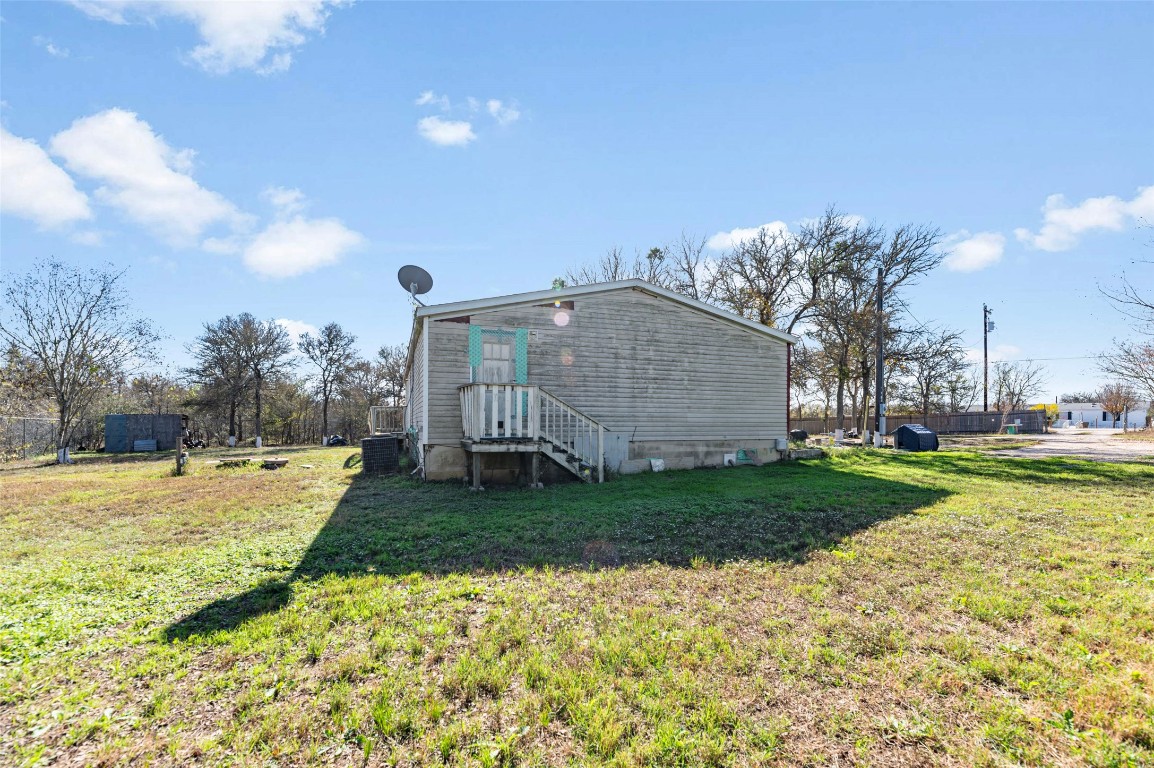 214 The Ranch Road Del Valle, TX 78617 - Photo 37 of 40 a view of a house with a yard and pathway