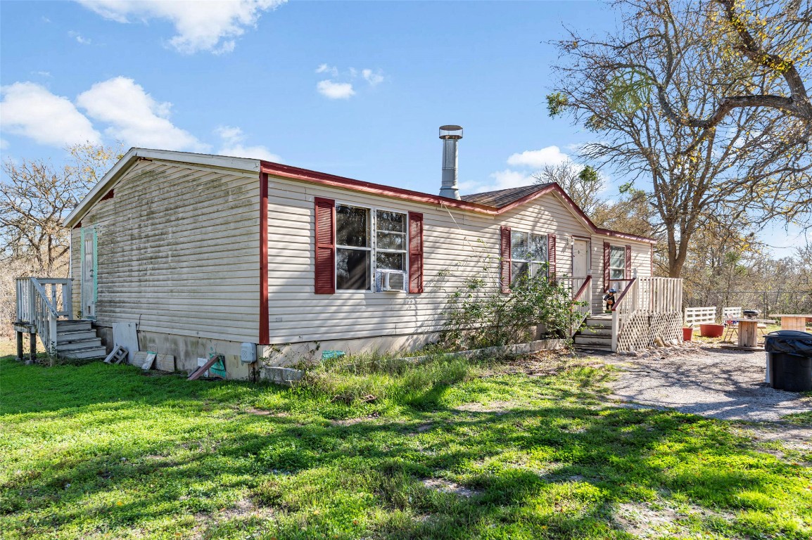214 The Ranch Road Del Valle, TX 78617 - Photo 40 of 40 a front view of a house with garden