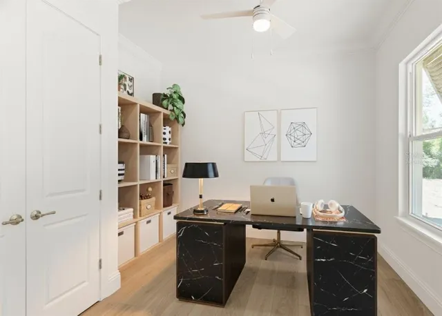 a view of an entryway with wooden floor