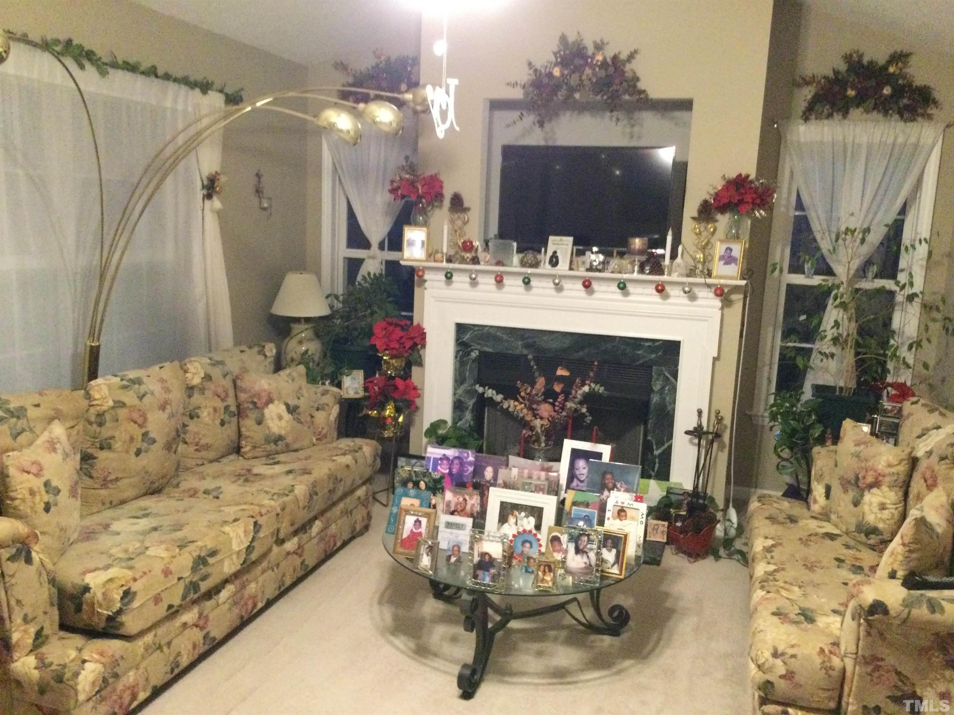 110 Impressive Lane Clayton, NC 27520 - Photo 3 of 14 a living room with furniture and a fireplace