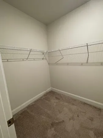a view of a room with racks on the wall