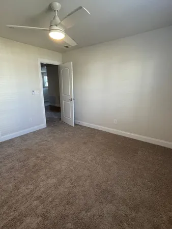 an empty room with an empty space and windows