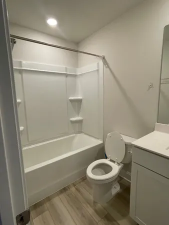 a bathroom with a sink a toilet and a bathtub
