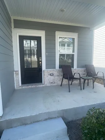 a living room with furniture and windows