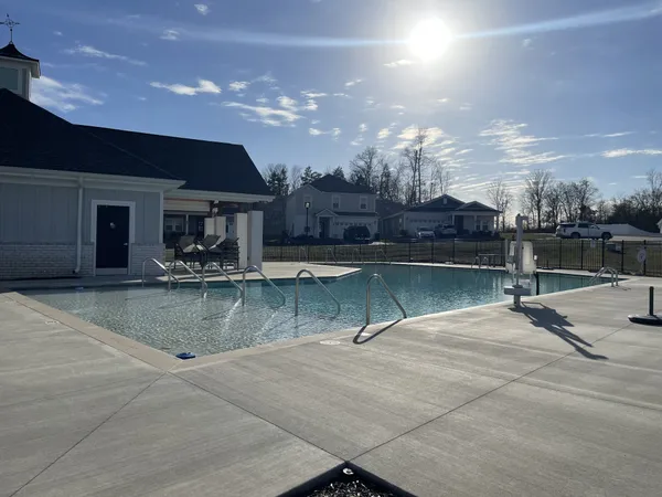 a view of a swimming pool with a patio