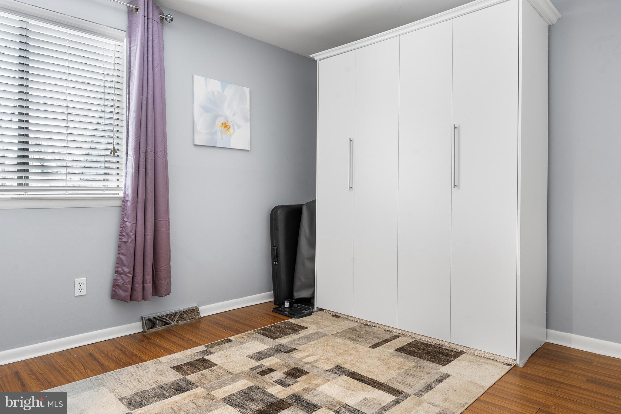 1237 Greeley Avenue Warminster, PA 18974 - Photo 102 of 107 a view of a bedroom with wooden floor and a window