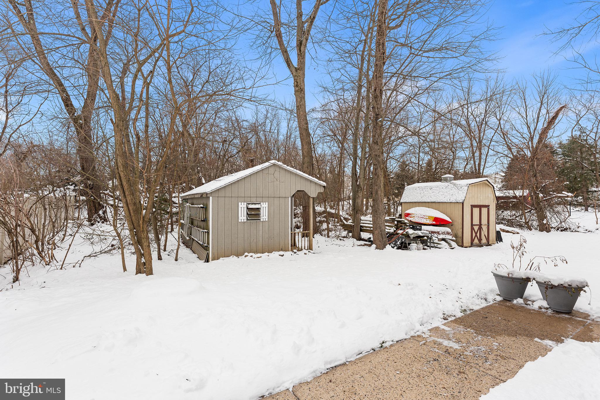 1237 Greeley Avenue Warminster, PA 18974 - Photo 12 of 107 a street view covered with snow in front of house