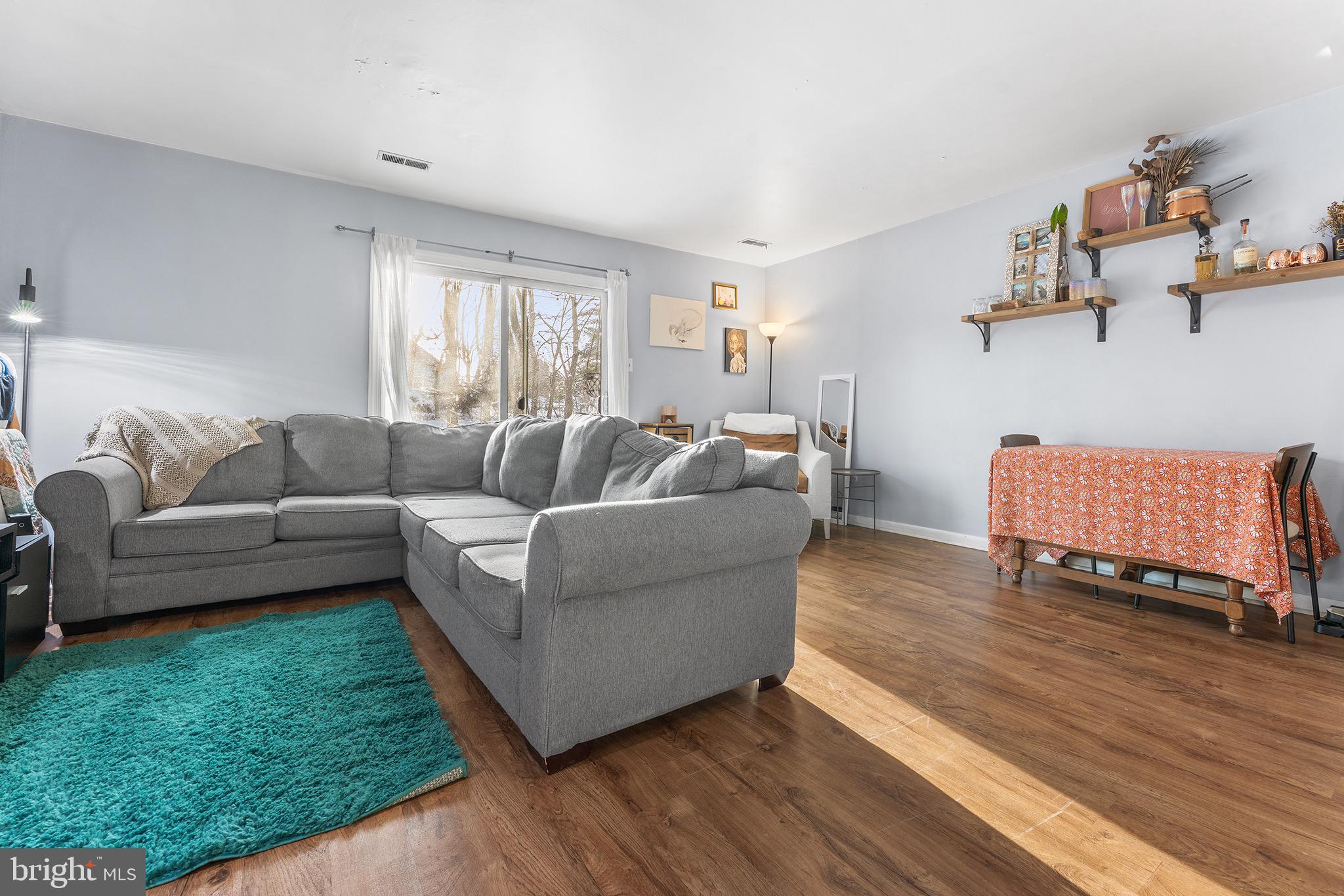 1237 Greeley Avenue Warminster, PA 18974 - Photo 23 of 107 a living room with furniture and a wooden floor