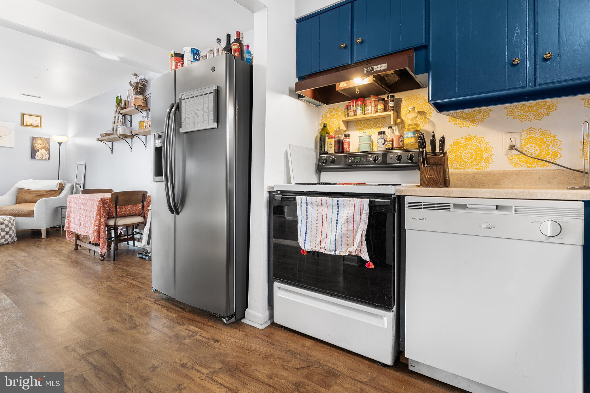 1237 Greeley Avenue Warminster, PA 18974 - Photo 33 of 107 a kitchen with stainless steel appliances a refrigerator and wooden floor