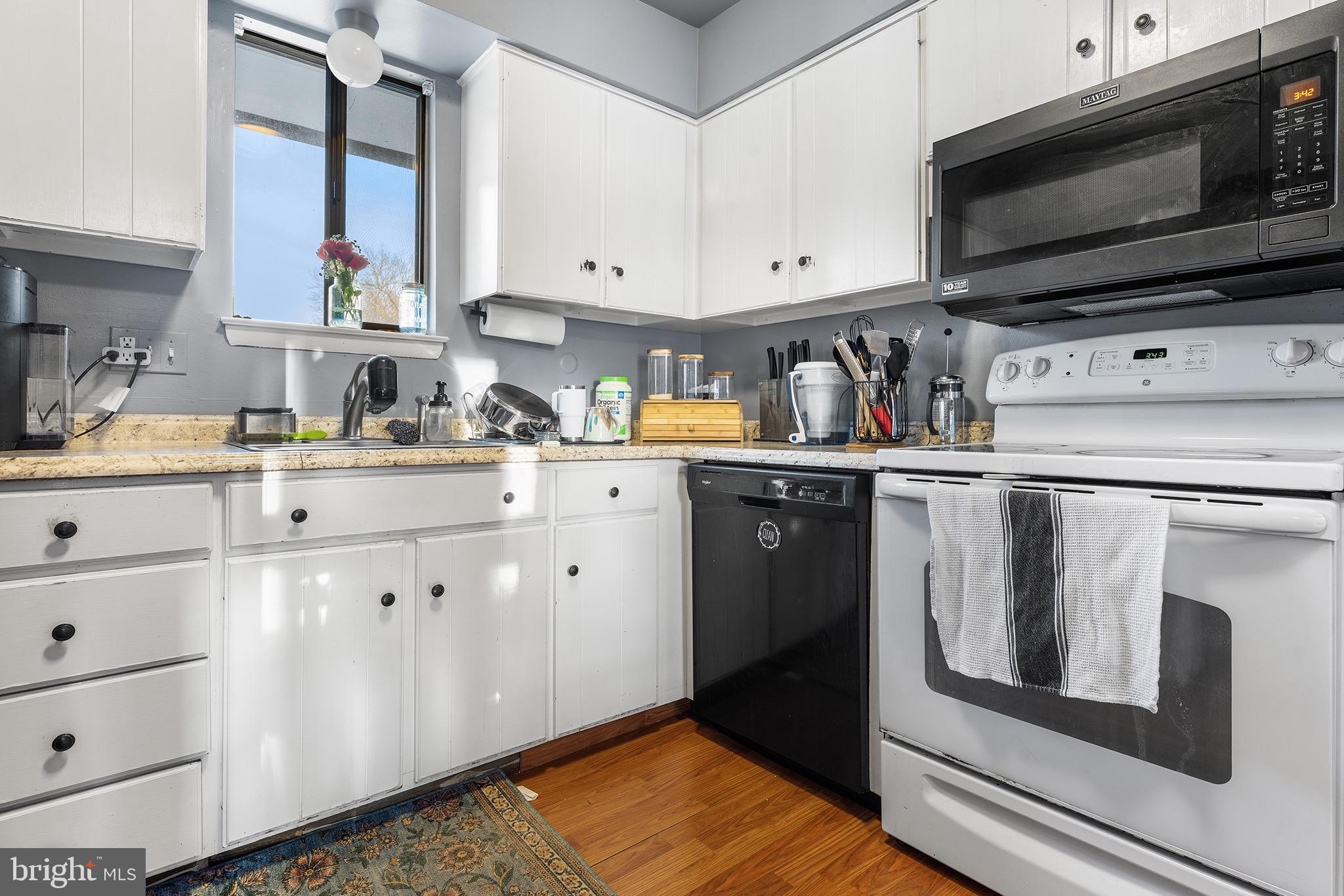 1237 Greeley Avenue Warminster, PA 18974 - Photo 36 of 107 a kitchen with stainless steel appliances granite countertop a sink a stove and cabinets