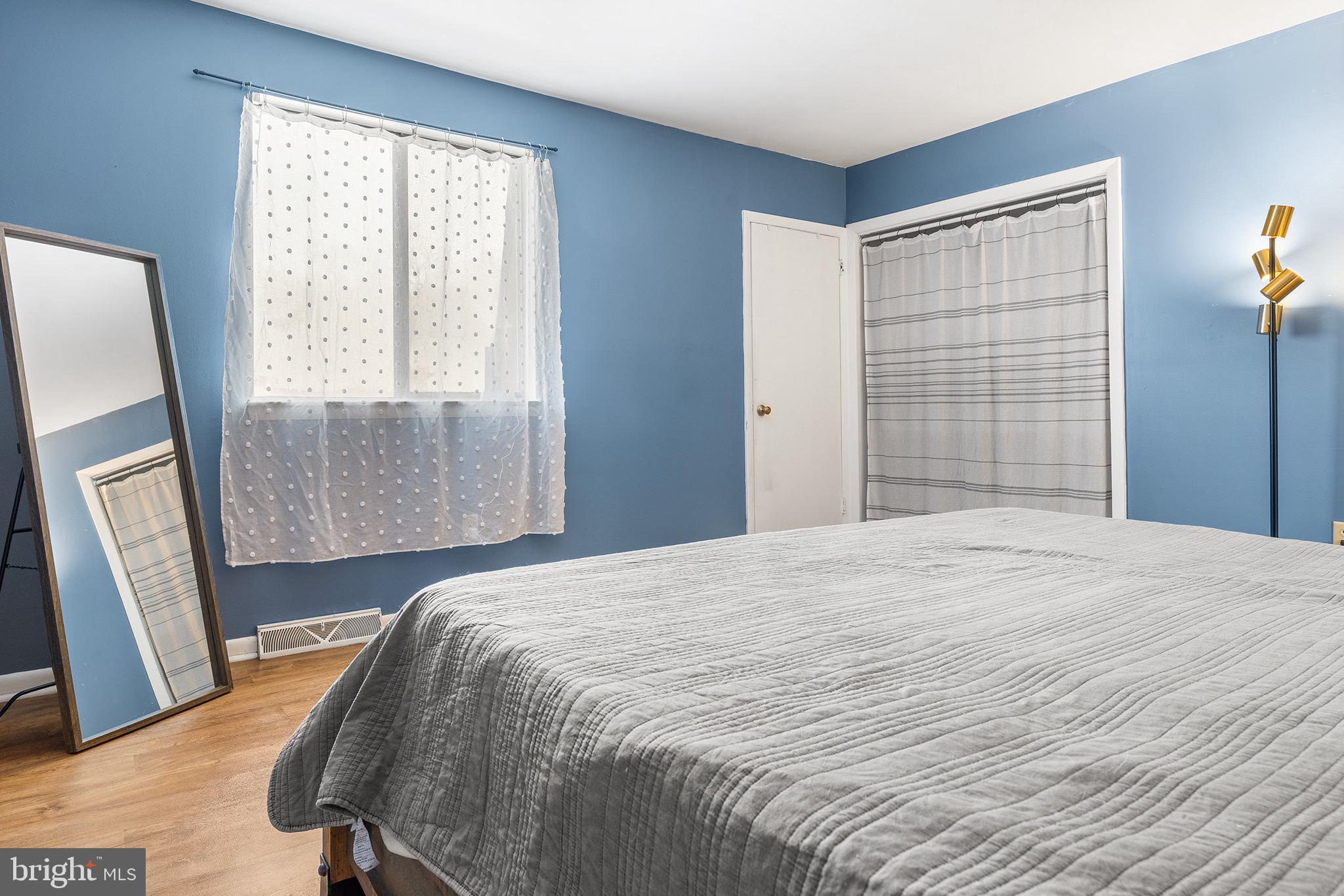 1237 Greeley Avenue Warminster, PA 18974 - Photo 46 of 107 a bedroom with a bed and wooden floor