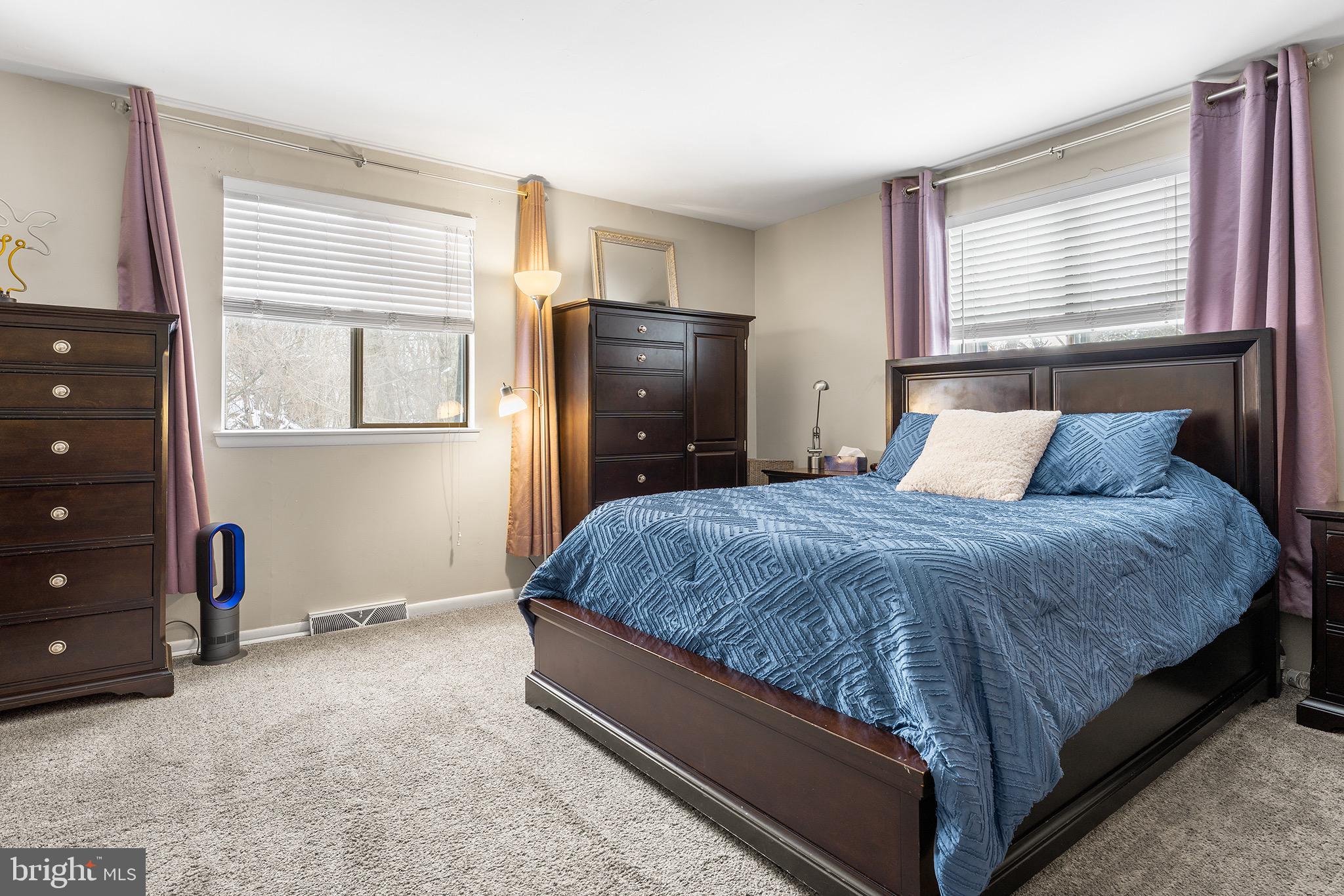 1237 Greeley Avenue Warminster, PA 18974 - Photo 90 of 107 a large bed sitting in a bedroom next to a window and dresser