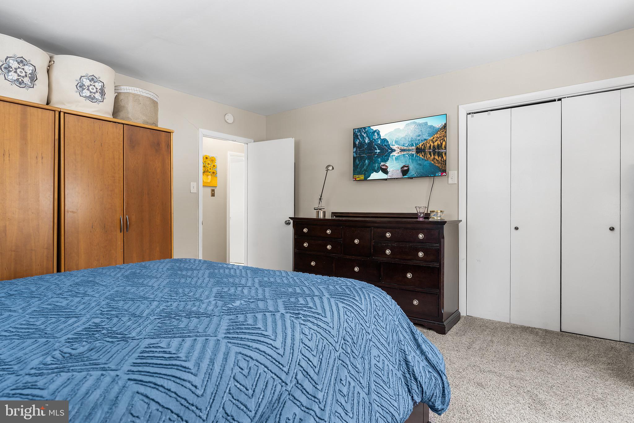 1237 Greeley Avenue Warminster, PA 18974 - Photo 97 of 107 a bedroom with a bed and a flat tv screen on dresser