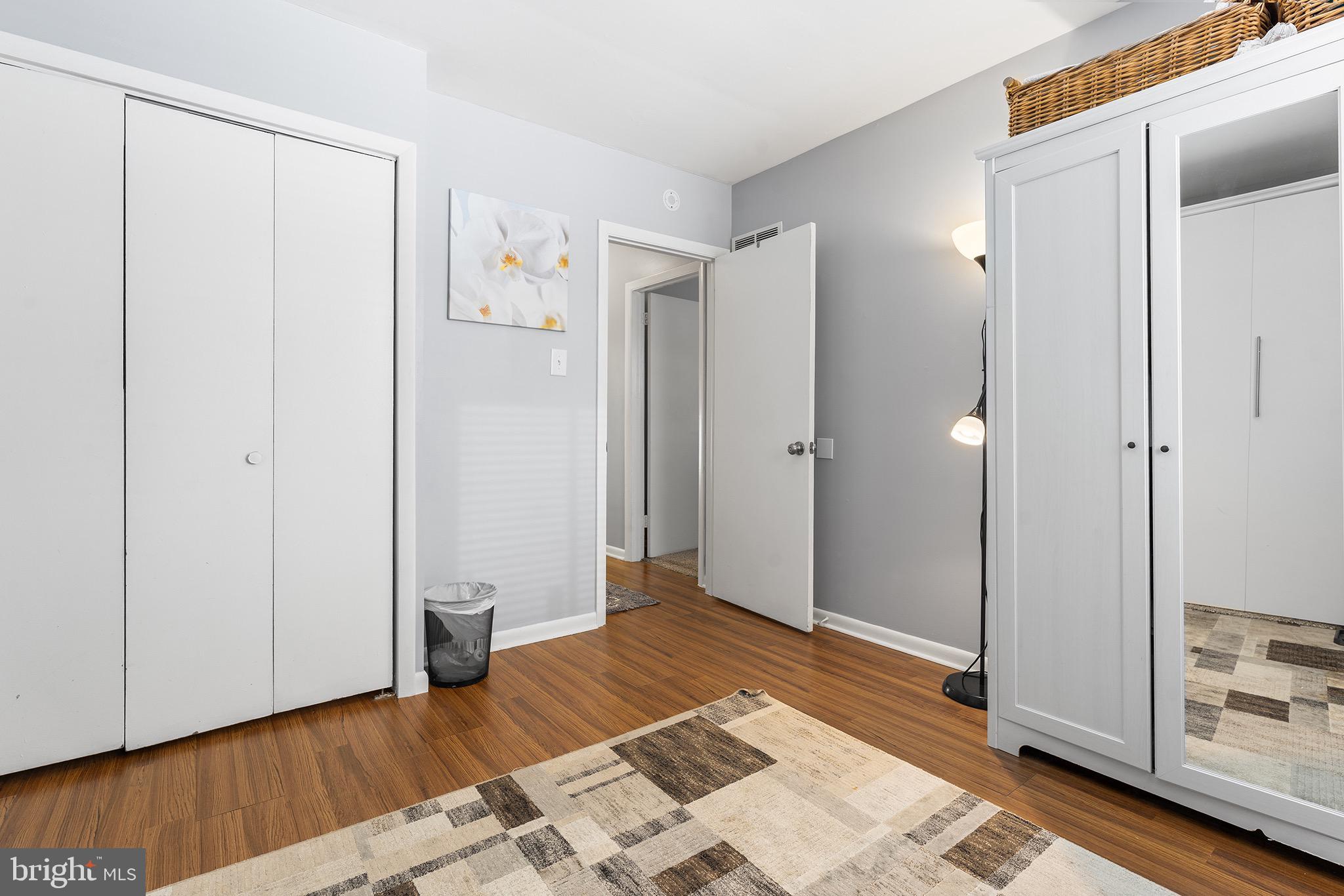 1237 Greeley Avenue Warminster, PA 18974 - Photo 99 of 107 a view of a bedroom with wooden floor and bathroom
