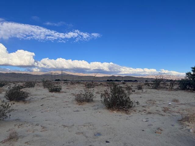 2-15 30th Avenue Thousand Palms, CA 92276 - Photo 3 of 7 a view of a dry yard with wooden fence