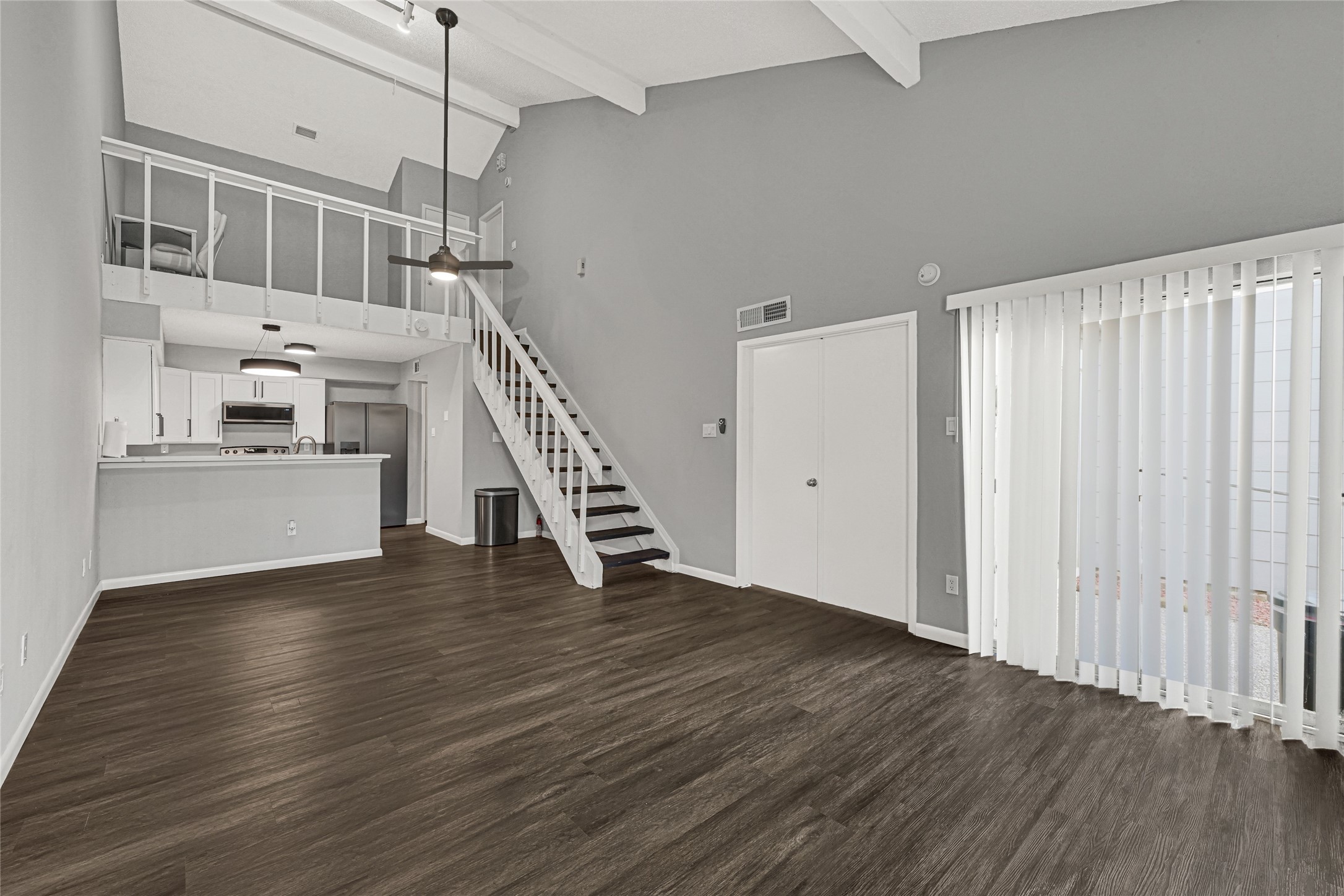 12111 Lemon Ridge Lane, Unit 121 Houston, TX 77035 - Photo 25 of 25 a view of empty room with wooden floor and stairs