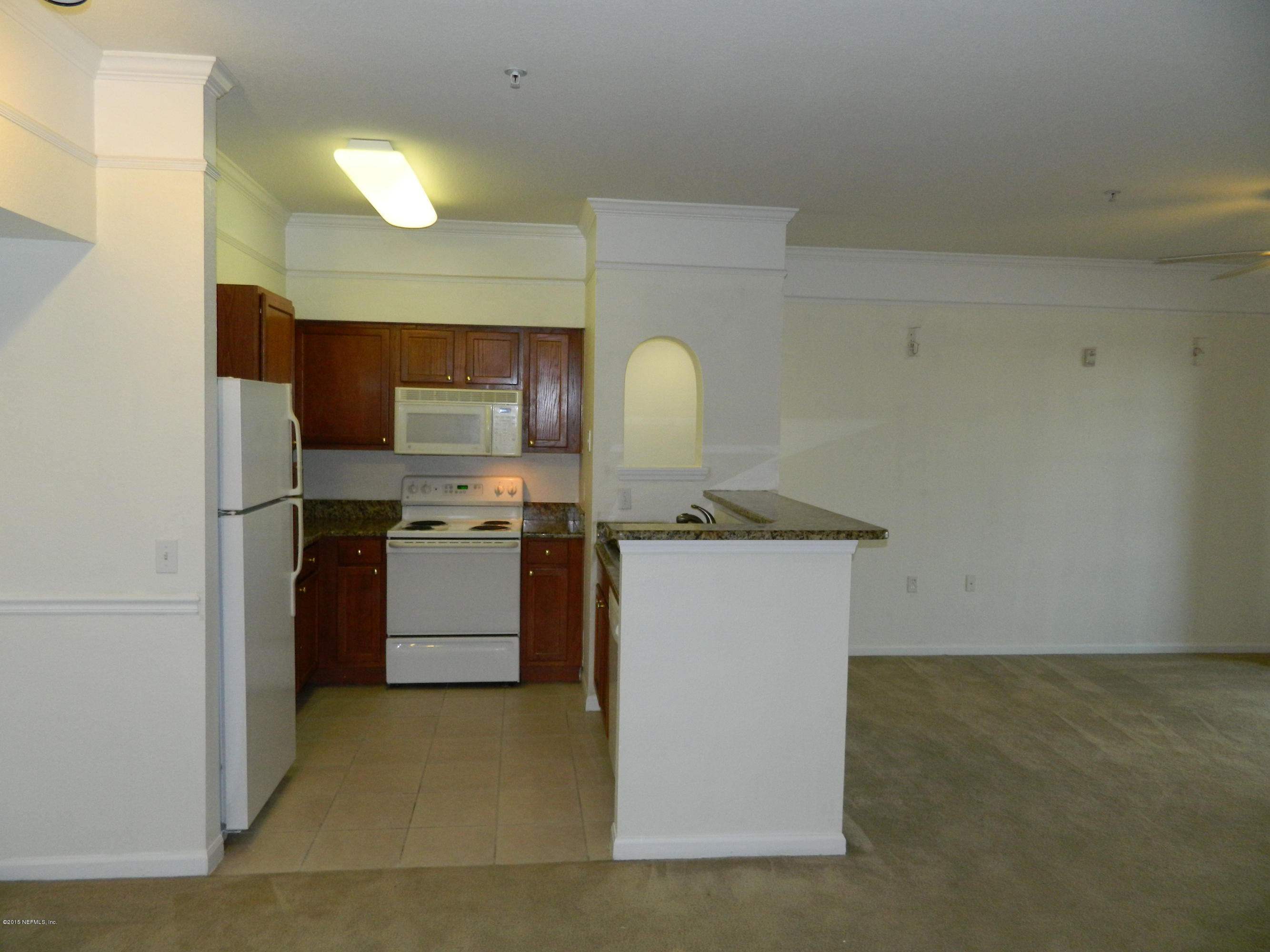 8550 Touchton Road, Unit 616 Jacksonville, FL 32216 - Photo 8 of 77 KITCHEN FROM DINING AREA