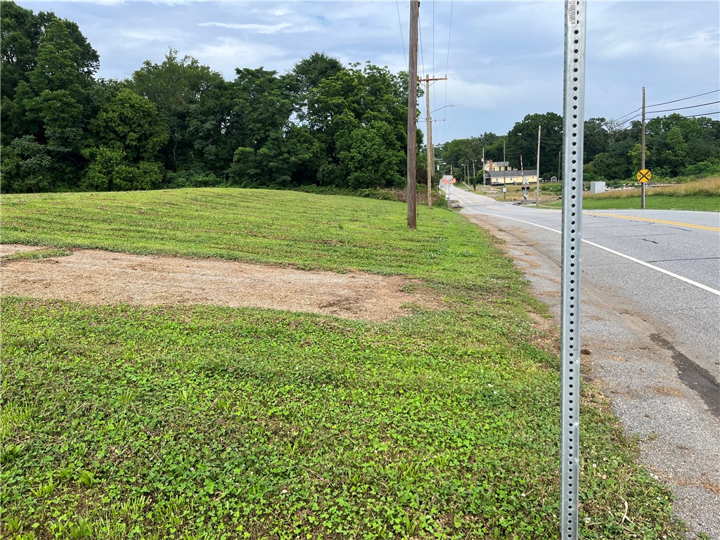 237 East Main Street Pendleton, SC 29670 - Photo 5 of 16 A promising roadside lot, ready for development with ample surrounding greenery.