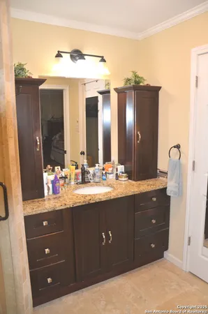 a bathroom with a double vanity sink and mirror