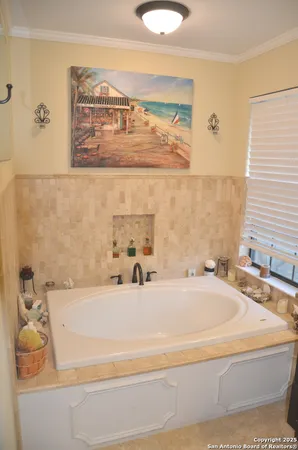 a bathroom with a bathtub and a sink