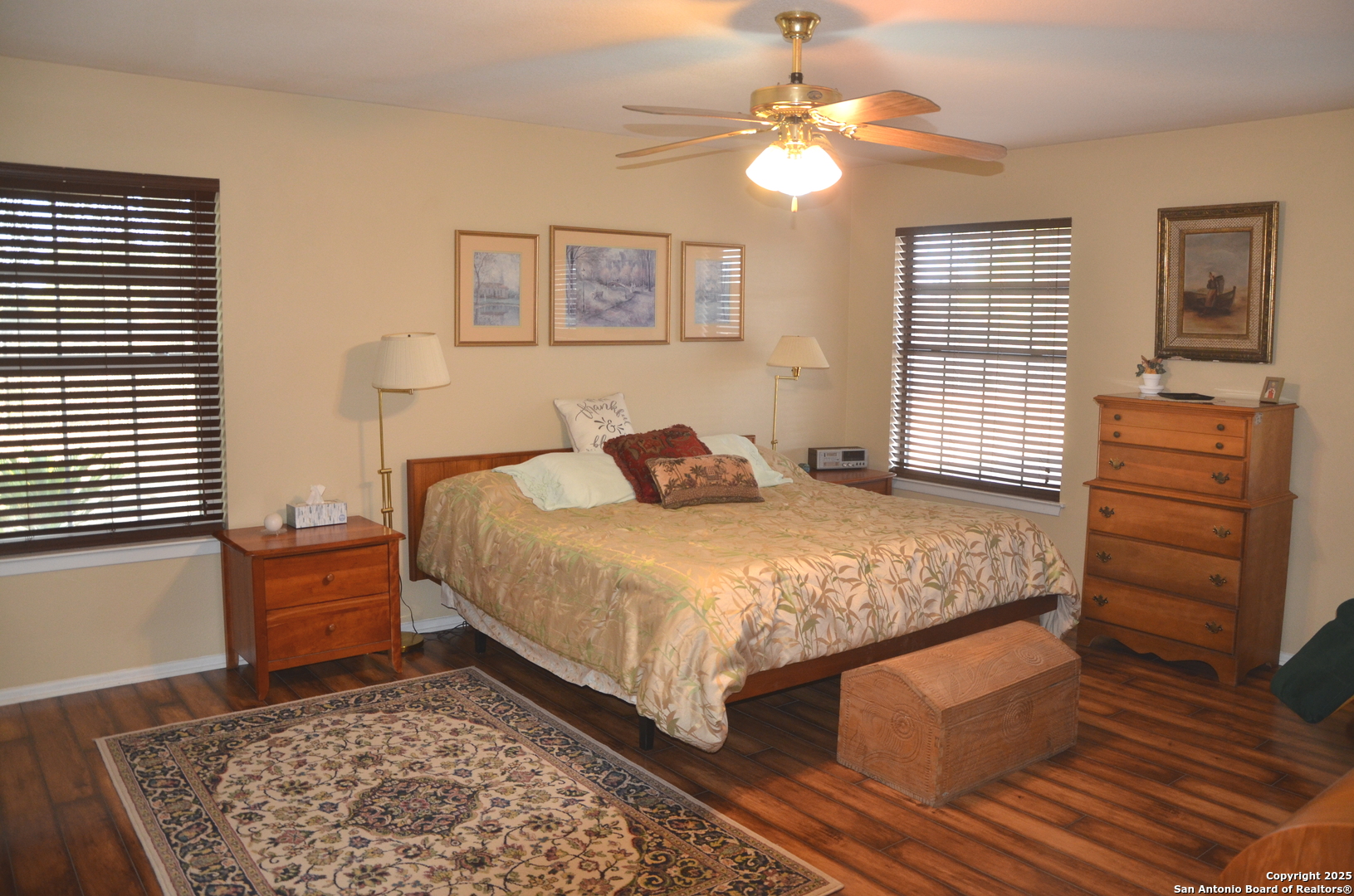 1219 County Road 761 Devine, TX 78016 - Photo 15 of 31 a bedroom with a bed and wooden floor