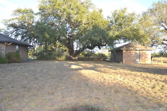 a view of back yard of the house
