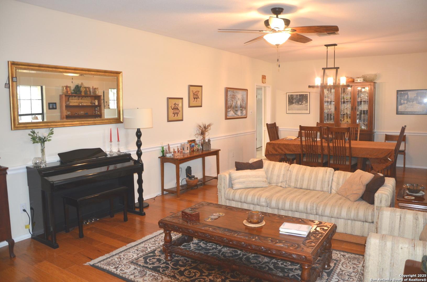 1219 County Road 761 Devine, TX 78016 - Photo 10 of 31 a living room with furniture and a fireplace