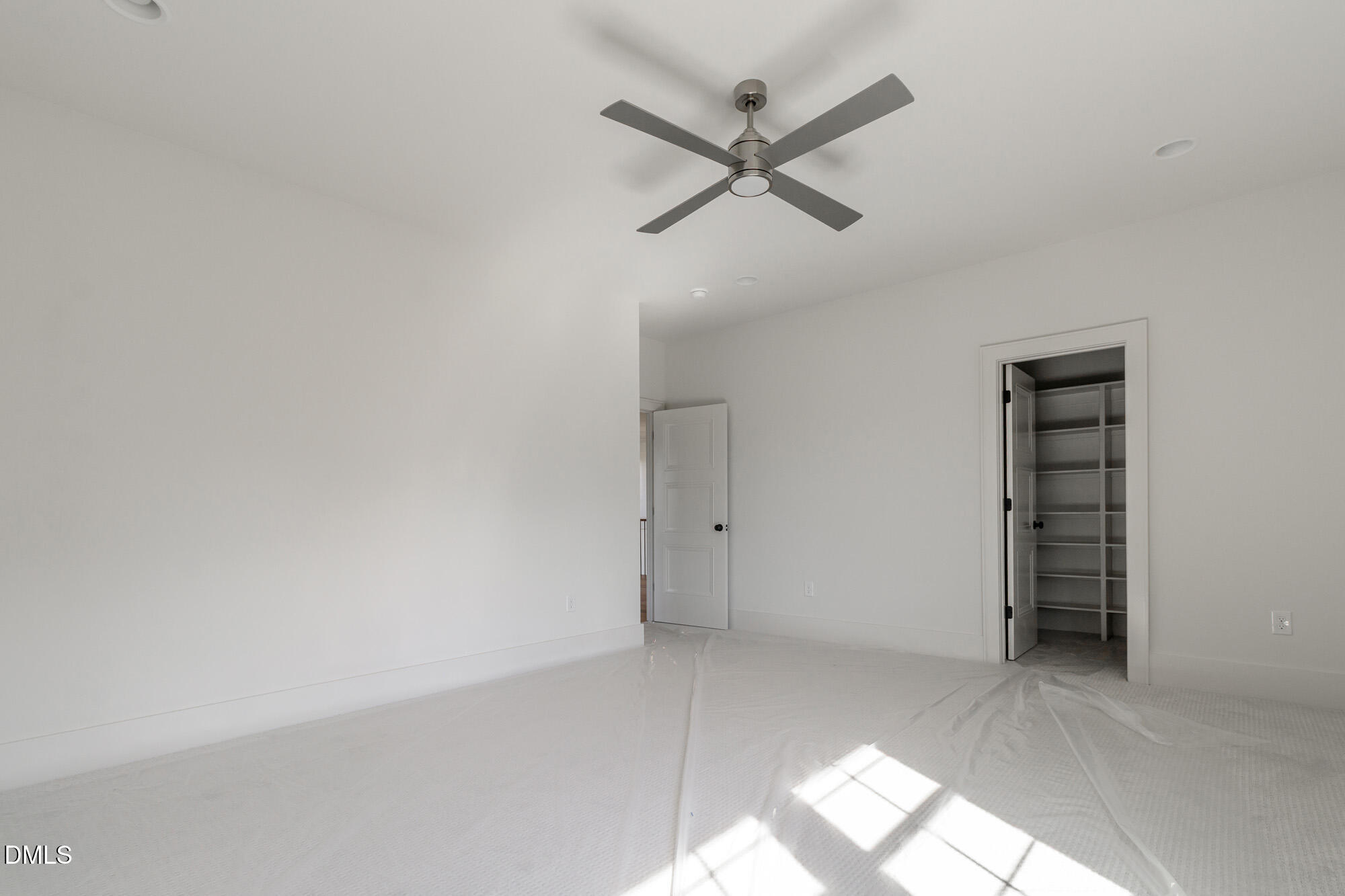 372 Firefly Overlook Pittsboro, NC 27312 - Photo 69 of 85 an empty room with closet and fan