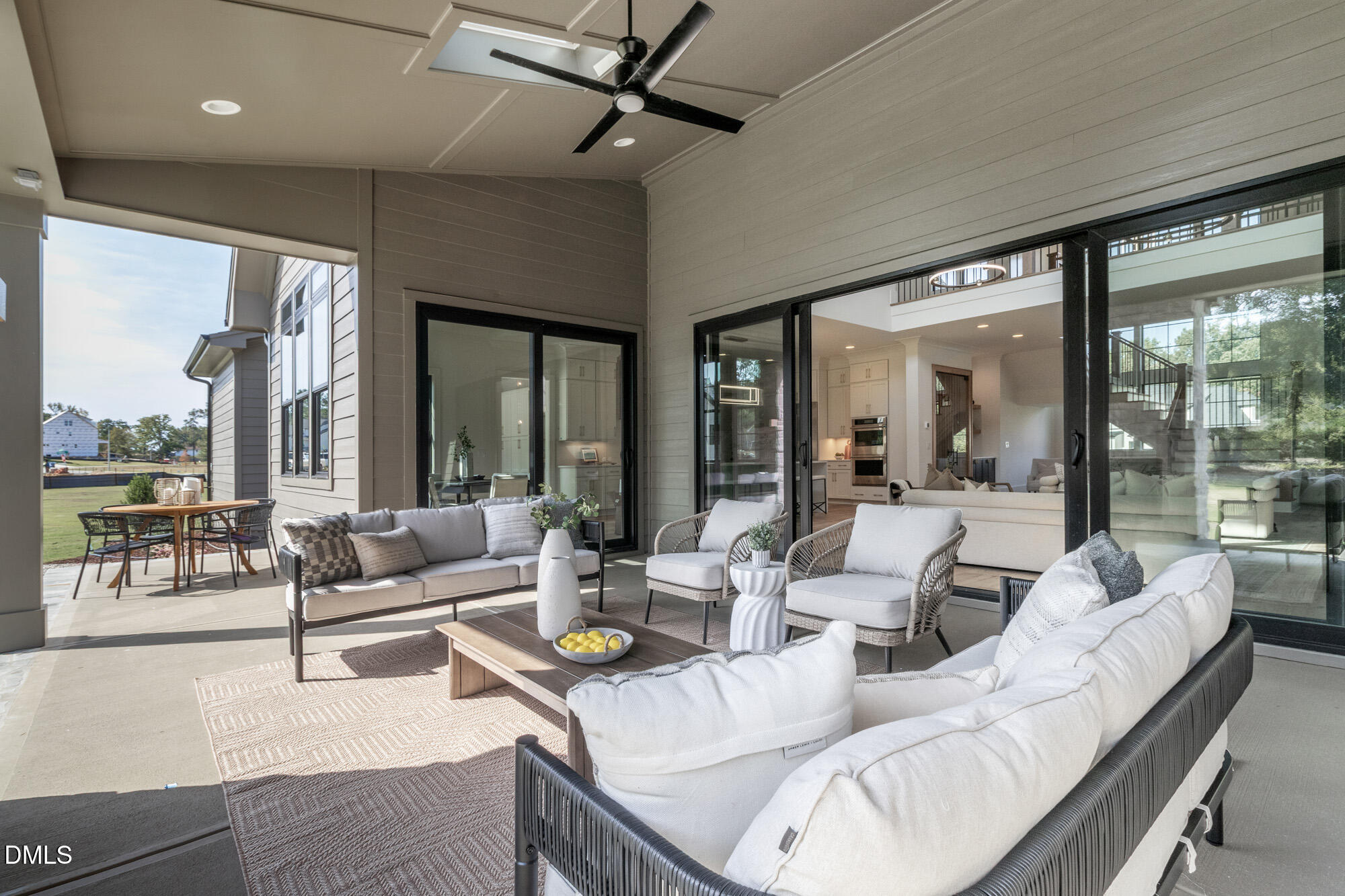 372 Firefly Overlook Pittsboro, NC 27312 - Photo 78 of 85 a living room with furniture and floor to ceiling windows
