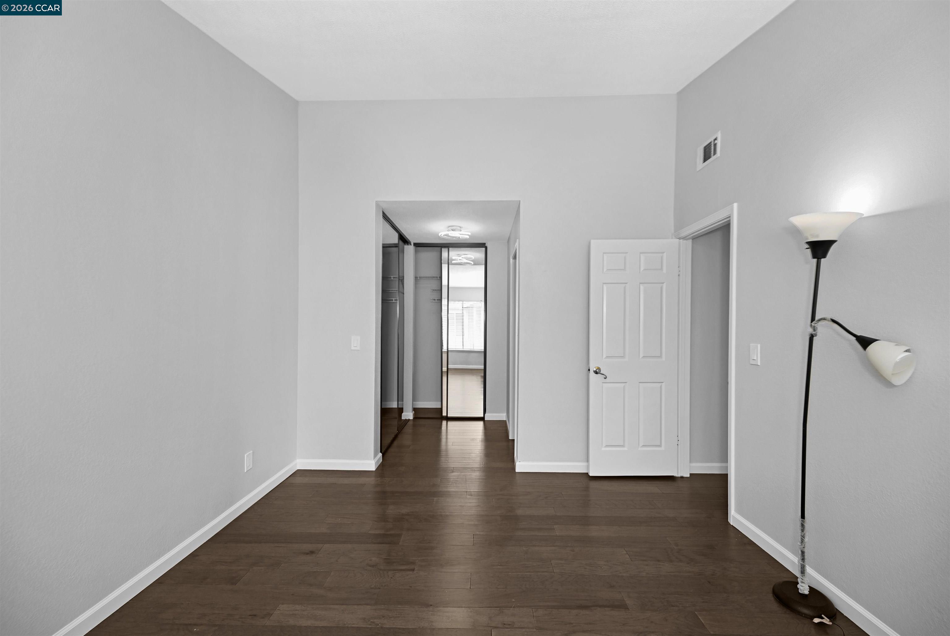 3659 Crow Canyon Road San Ramon, CA 94582 - Photo 21 of 26 a view of an empty room with wooden floor and a window